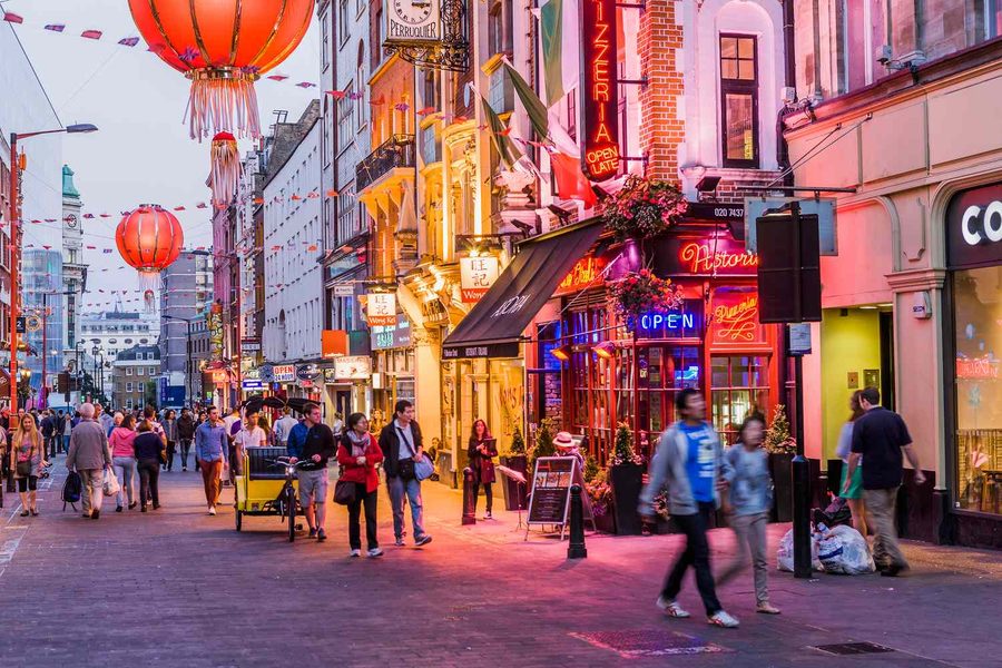 People walking through London nightlife streets